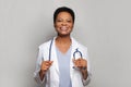 Optimistic positive confident doctor woman medical worker with stethoscope on white background Royalty Free Stock Photo