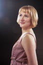 Optimistic Smiling Caucasian Blond Female in Pink Dress.