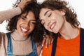Optimistic two multiracial girls friends