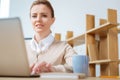 Optimistic woman working in the office