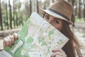 Optimistic young woman is holding card near face