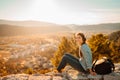 Optimistic young woman listening to music podcast stream over headphones,enjoying in nature at sunset.Musical therapy.Day in Royalty Free Stock Photo