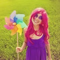 Optimistic young woman wearing pink wig