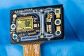 Optoelectronic image sensor of optical laser computer mouse on a blue background