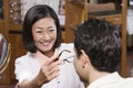 Optometrist Assisting Patient In Choosing Glasses Royalty Free Stock Photo