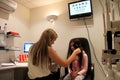 Optometrist checking little girls eyes. Royalty Free Stock Photo