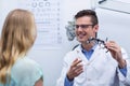 Optometrist discussing on messbrille with female patient