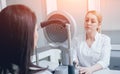 Optometrist is doing corneal topography. Corneal exam. Ophthalmology clinic Royalty Free Stock Photo