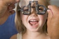 Optometrist in exam room with young girl Royalty Free Stock Photo