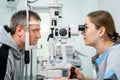 Optometrist examining the eyes of a male patient in a modern ophthalmology clinic. Eye doctor with man patient during an Royalty Free Stock Photo