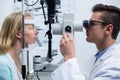 Optometrist examining female patient on slit lamp Royalty Free Stock Photo