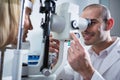 Optometrist examining female patient on slit lamp Royalty Free Stock Photo