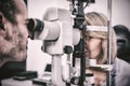 Optometrist examining female patient on slit lamp Royalty Free Stock Photo