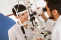 Optometrist examining patient in modern ophthalmology clinic Royalty Free Stock Photo