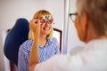 Optometrist examining patient in modern ophthalmology clinic Royalty Free Stock Photo