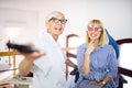 Optometrist examining patient in modern ophthalmology clinic Royalty Free Stock Photo