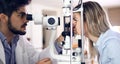 Optometrist examining patient in modern ophthalmology clinic Royalty Free Stock Photo