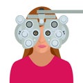 Optometrist examining woman with a trial frame in ophthalmology clinic. Modern light ophthalmology clinic. Medical