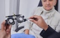 Optometrist hands, test glasses and senior woman for health advice and helping hand in consultation room. Elderly Royalty Free Stock Photo