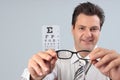 Optometrist holding eye frames Royalty Free Stock Photo