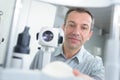 optometrist with non contact tonometer checking patient intraocular pressure Royalty Free Stock Photo