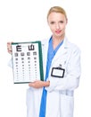 Optometrist present with eye chart Royalty Free Stock Photo