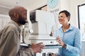 Optometrists are eternal optimists. an optometrist examining her patients eyes with an autorefractor.