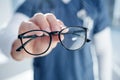 Optometry, glasses and hands of person with frames, prescription lens and spectacles for sight. Healthcare
