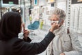 Optometry, Islamic woman and customer in store, glasses and healthcare for vision, retail an testing. Optometrist