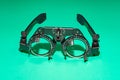 Optometry optics test glasses on a green table. Royalty Free Stock Photo