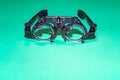 Optometry optics test glasses on a green table. Royalty Free Stock Photo