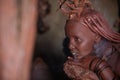 A traditional himba tribe woman doing her beauty procedure Royalty Free Stock Photo