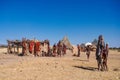 Opuwo, Namibia - Jul 07, 2019: Himba women with the typical necklace and hairstyle in himba tribe village