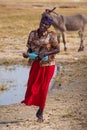 Opuwo, Namibia - Jul 06, 2019: Namibian women with her donkey, seen in Opuwo in the Kunene Region of Namibia