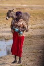 Opuwo, Namibia - Jul 06, 2019: Namibian women with her donkey, seen in Opuwo in the Kunene Region of Namibia