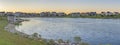 Oquirrh Lake with covered dock and surrounded by grass at Daybreak, Utah Royalty Free Stock Photo