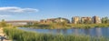 Oquirrh Lake at the front of residential complex buildings at Daybreak, Utah