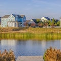 Oquirrh Lake with a wooden deck and lovely homes Royalty Free Stock Photo