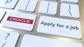 ORACLE company logo and Apply for a job text on the keys of the computer keyboard, editorial conceptual 3D rendering