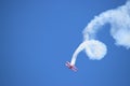 Oracle Stunt airplane performing a corkscrew