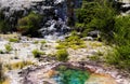 View on cascade with steaming hot clear blue alkali chloride thermal pool Royalty Free Stock Photo