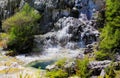 View on cascade with steaming hot clear blue alkali chloride thermal pool Royalty Free Stock Photo