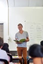 Oral assignments are a great way to build confidence. a young schoolboy giving a presentation in front of class. Royalty Free Stock Photo