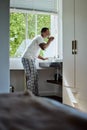 Oral care, brushing teeth and black man with dental hygiene in the bathroom of his modern home. Grooming, healthcare and Royalty Free Stock Photo