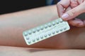 Oral contraceptive pills in woman hands, Blisters of birth control pills