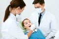 Oral Health Care. Dentist Doctors Making Examination Procedure