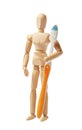 Oral hygiene and dental care. Wooden man holds toothbrush and toothpaste