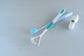 Oral hygiene health concept. Closeup dental tools toothbrush and tongue cleaner