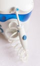 Oral hygiene. Irrigator for cleaning teeth on a white background Royalty Free Stock Photo