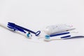 Oral hygiene, tooth brush, tooth paste and self cleaning tools on a white background Royalty Free Stock Photo